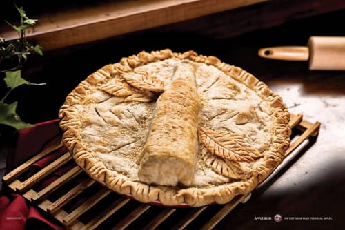 Apple beer ads - Apple bottle inside pie.