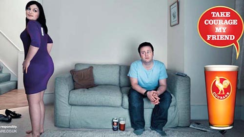 John Courage ads - Take Courage My Friend - man sitting on sofa worried when his girlfriend asks him if her bottom looks big!