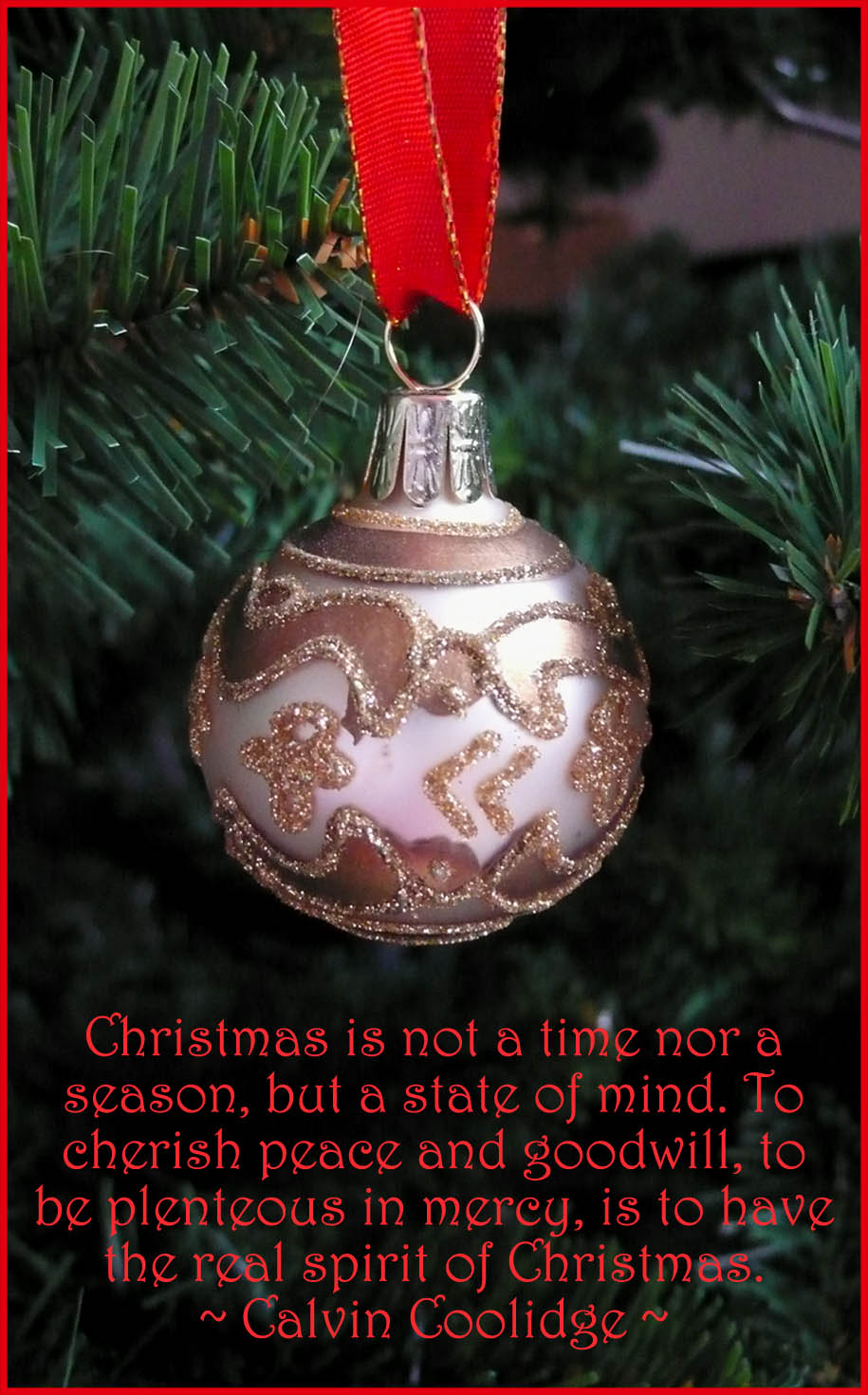 Merry Christmas quote on greeting card. Picture of gold christmas ball on tree.