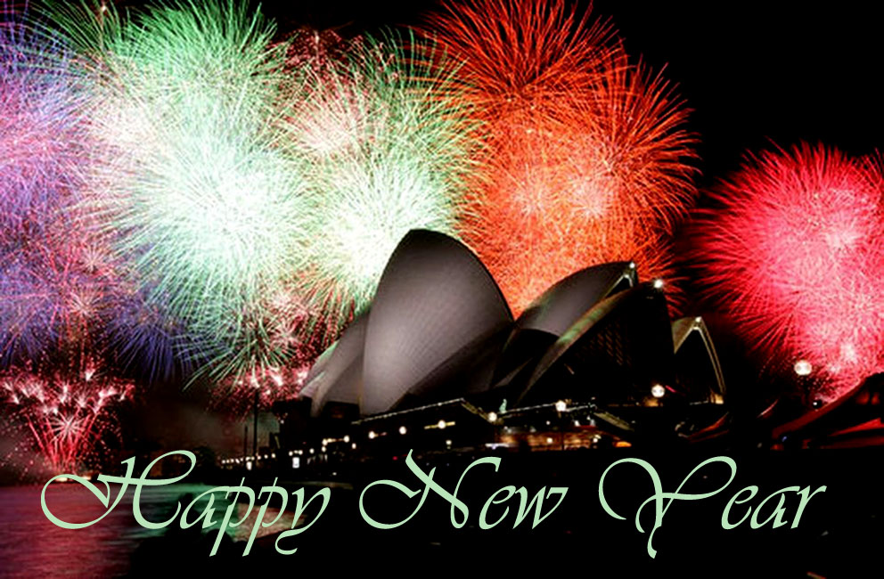 Sydney Opera House by night with colorful fireworks.