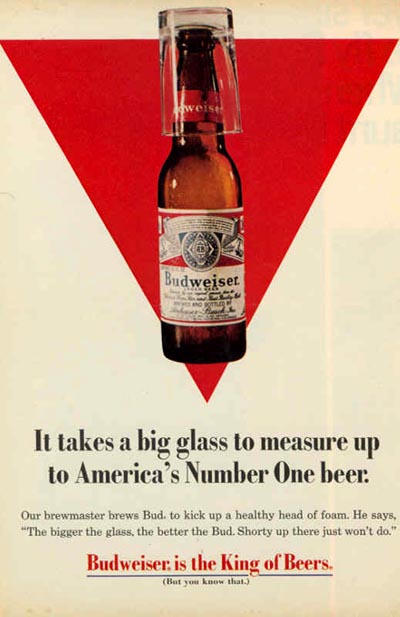 Old Budweiser ad - Red triangle background and a Budweiser bottle and glass - It takes a big glass to measure up to America's Number One beer!