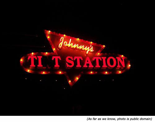 Hilarious signs: Funny neon sign with Johnny's Tit Station.