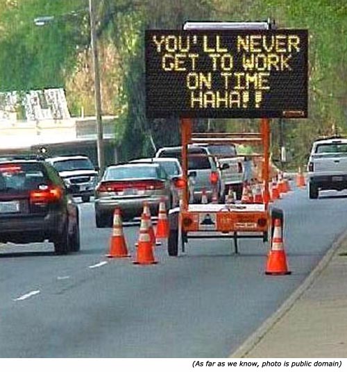 Funny road work sign: You'll never get to work on time, ha ha!