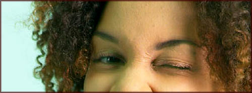 Woman winking - close up of eyes.