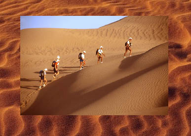 Great photo of people walking through desert for a photo travel book