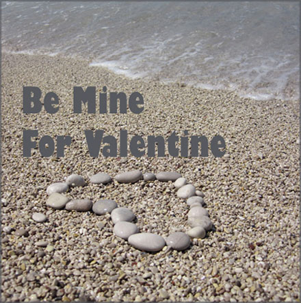 Free Valentines Day Pictures. Sharp photo of pebbles forming a heart on the sand on the beach.