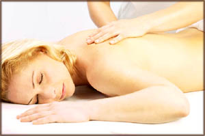 Wonderful Valentine massage: Photo of woman relaxing and getting a massage on her back.