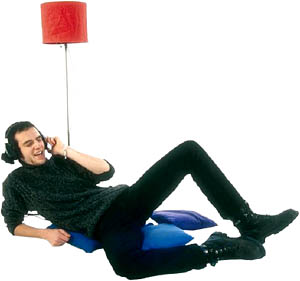 Great Valentines Gifts for him: Man lying down with headphones relaxing.