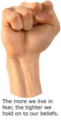 Clenched fist illustrating the fearful holding onto beliefs.