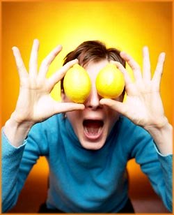 Funny Bipolar Test: Funny picture of man holding lemons in front of his eyes.