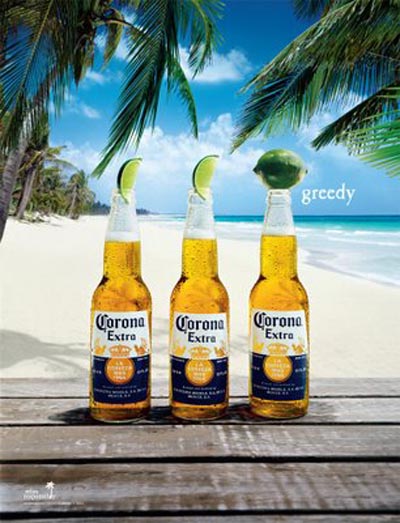 Three Corona Extra bottles on a beach: Greedy!