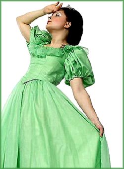 Bizarre facts: Woman in green dress holding her hand to her forehead as if she is about to faint.