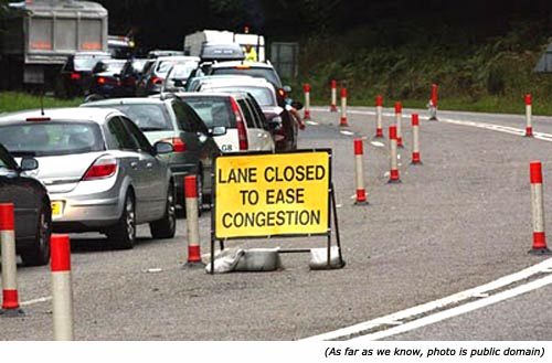 Hilarious silly sign and funny road work sign: Lane closed to ease congestion!