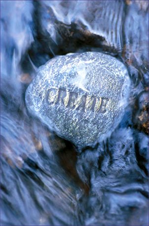 Inspirational Quotations - stone carving the word CREATE in flowing water
