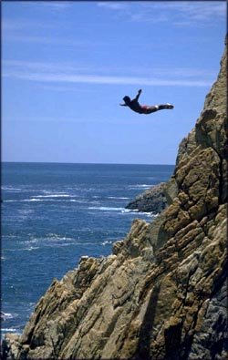Don't let fear run your life: Man jumping out from cliff down into the water.