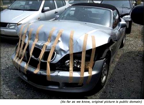 Funny car picture, car held together with duct tape.