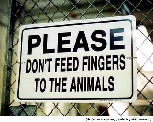 Funny warning sign and zoo signs: Please, don't feed fingers to the animals!