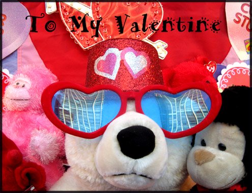 Funny Valentine cards: Photo of a teddy bear with giant sunglasses shaped as hearts and a party hat.