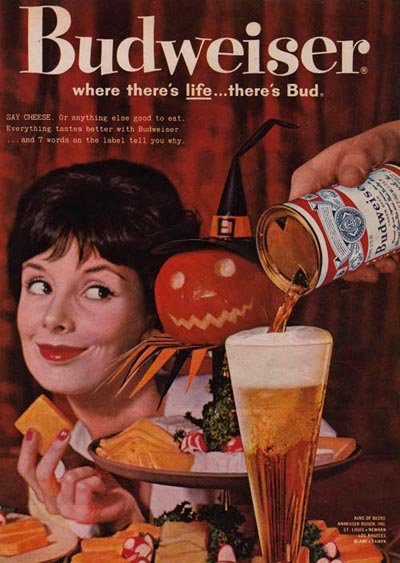 Old Budweiser commercials - Picture of a woman and a Halloween pumpkin. Budweiser: Where there's Life ... There's Bud!