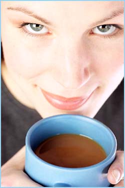 Funny facts about coffee and hallucinations: Photo of woman drinking a cup of coffee.